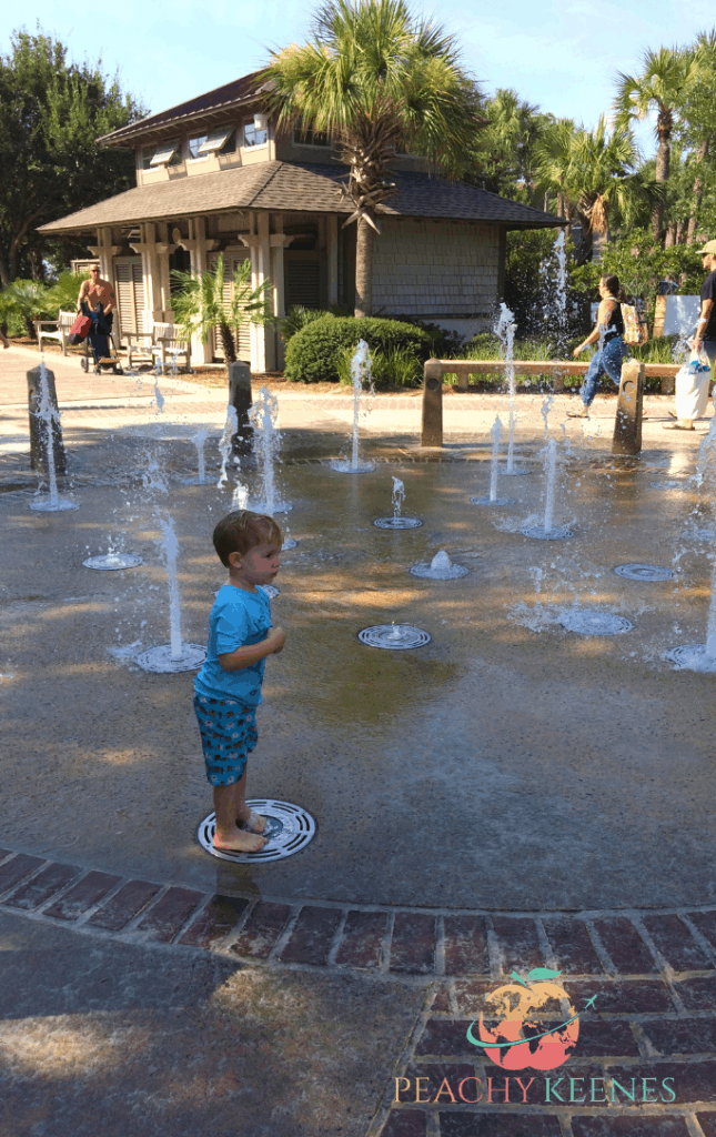 Little Boy Playing in a Fountain at Caligny Beach