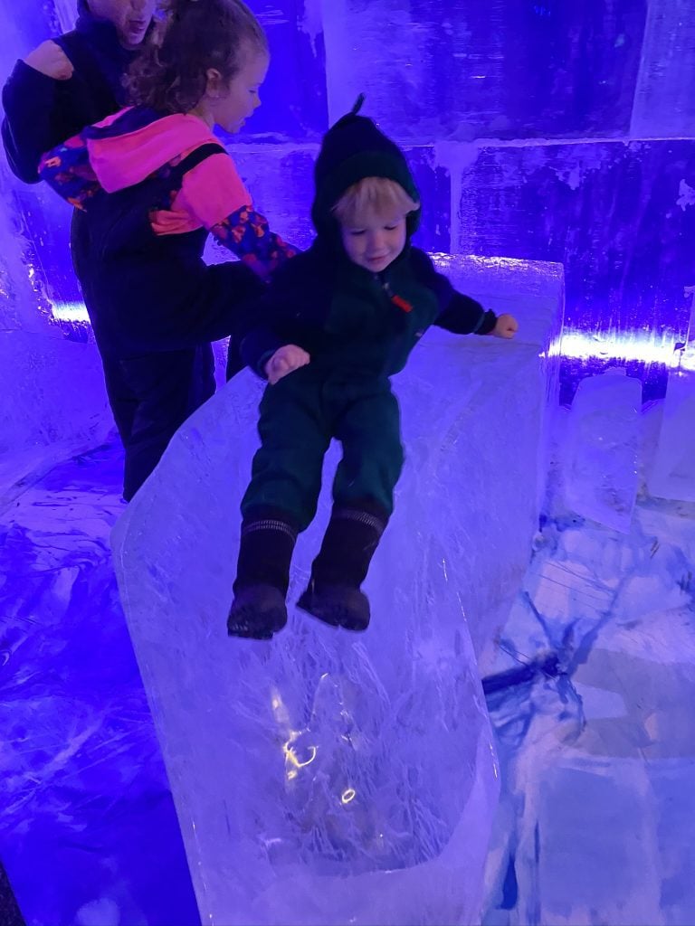 child on ice slide
