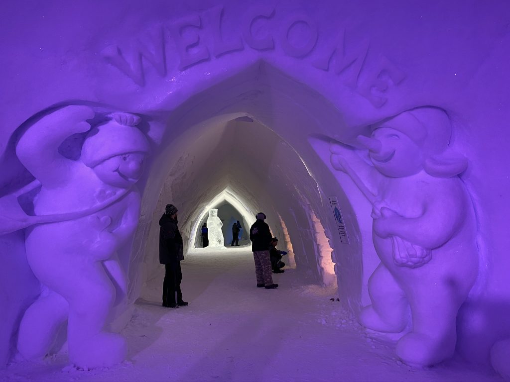 Snow sculptures of snowmen and Welcome Sign Inside Snowman World